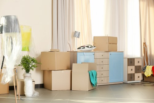 Professional movers packing boxes efficiently