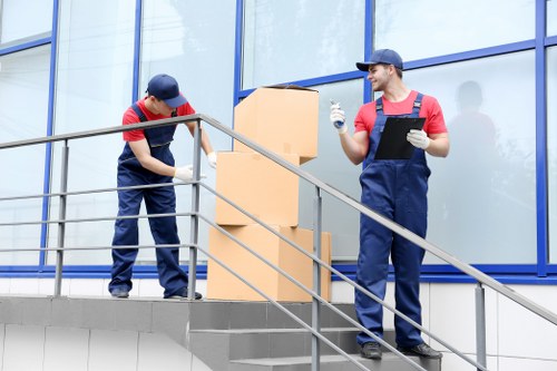 Professional movers handling furniture during pick-up