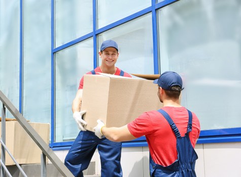 Professional office movers handling equipment